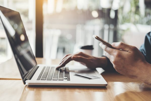 Online banking businessman using Laptop with credit card Shopping online Fintech and Blockchain concept