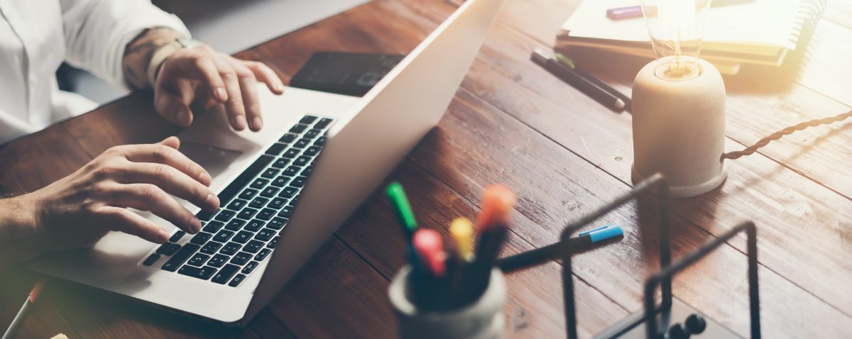 Male hands with laptop