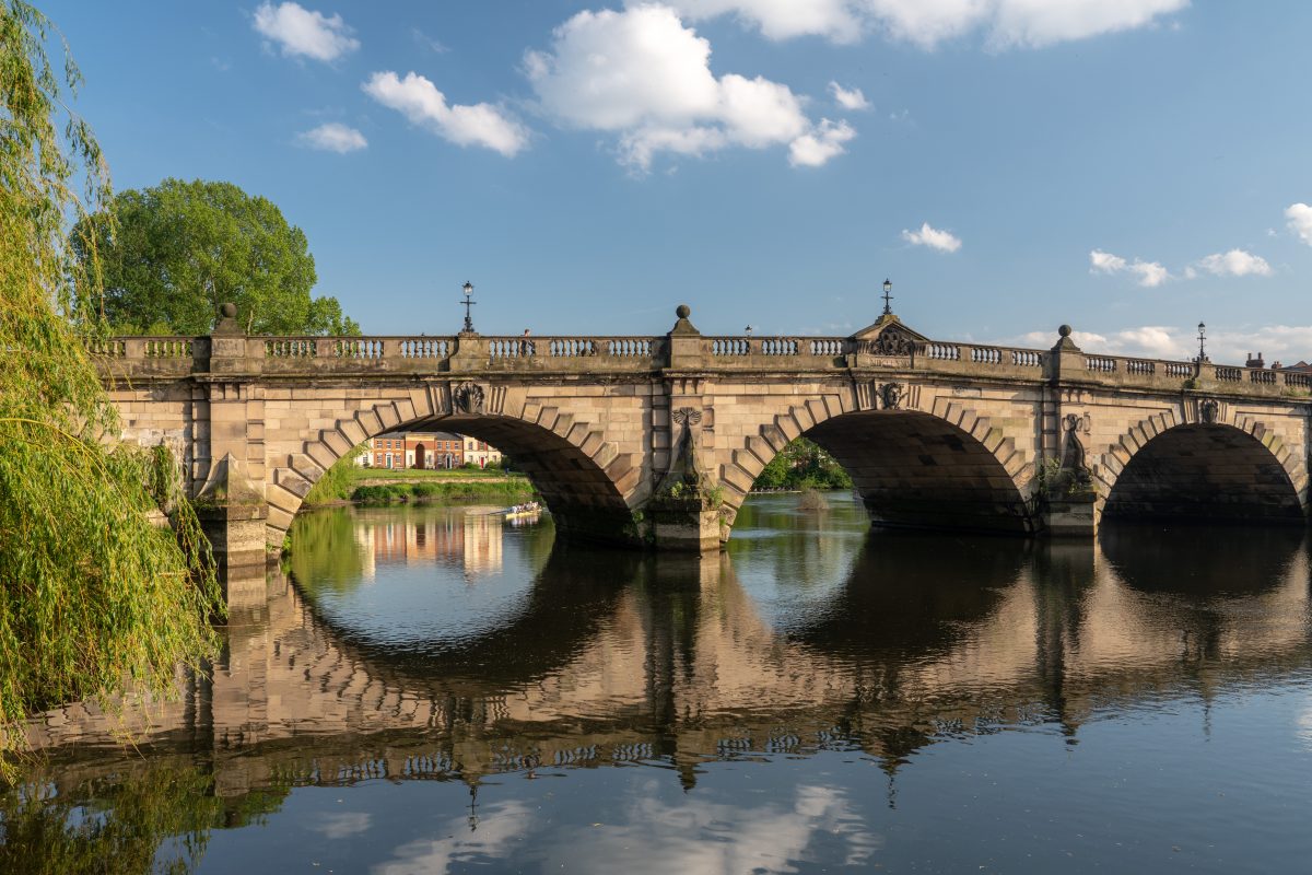 View of river Severn and English Bridge in Shrewsbury Shropshire with retirement apartments in background