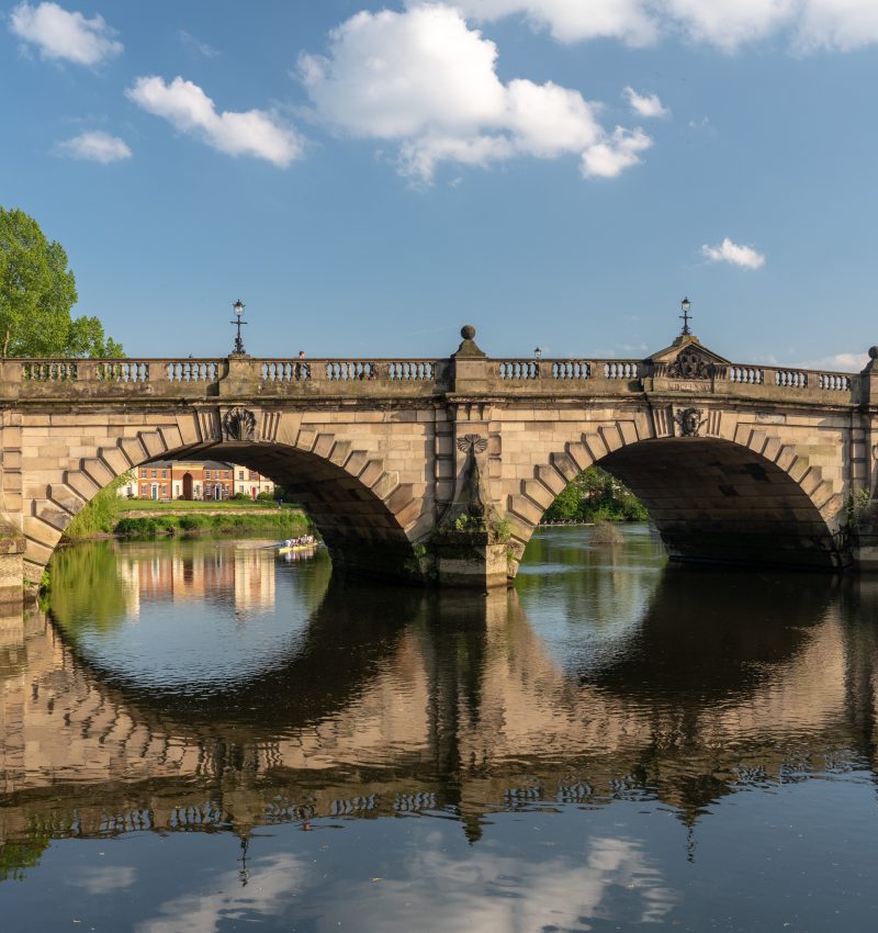 View of river Severn and English Bridge in Shrewsbury Shropshire with retirement apartments in background