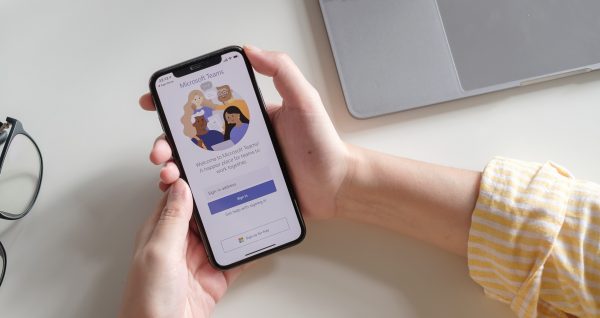 CHIANG MAI, THAILAND - JULY 3, 2020 : A working from home employee is downloading the Microsoft Teams social platform, ready for remote working in isolation from home