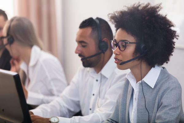 Portrait Of A Smiling African Female Customer Service Executive